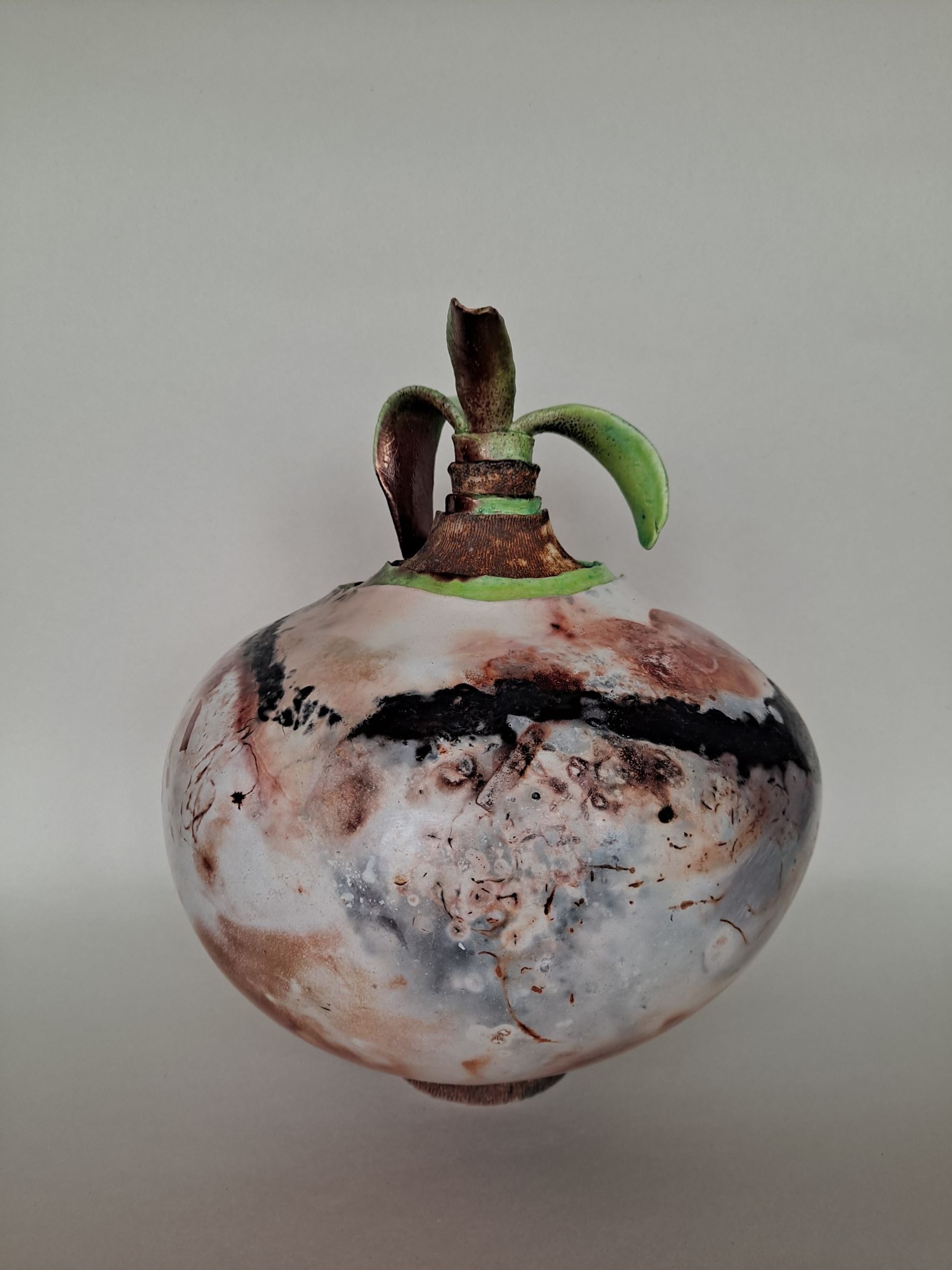 Raku vase in the shape of a bulb and leaves